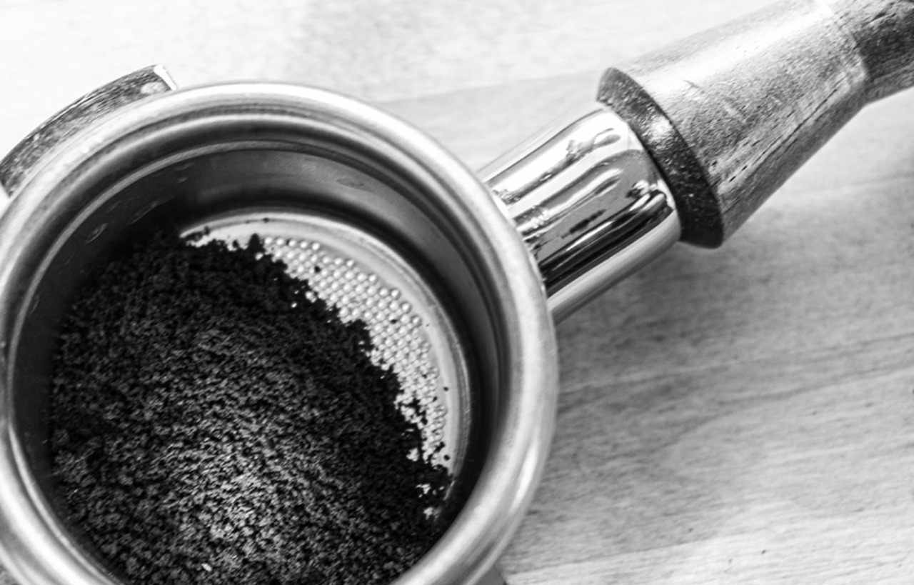 close up of ground coffee inside a portafilter